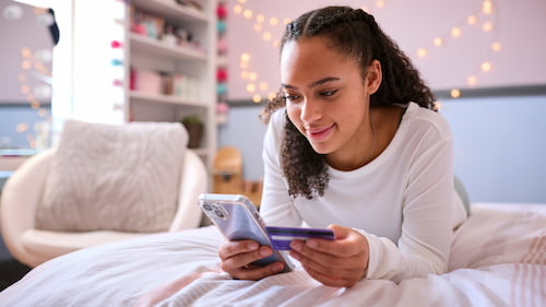 Teen using mobile banking