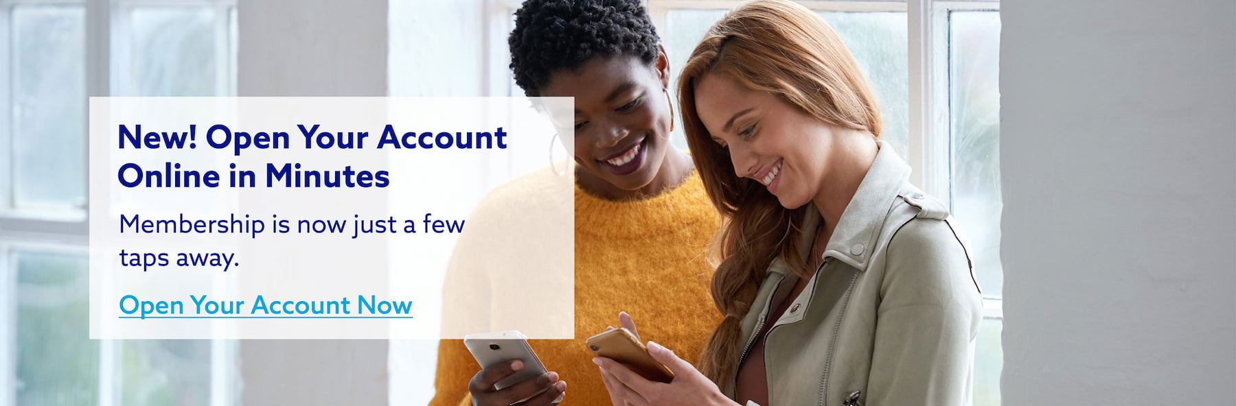 Two young women smiling and looking at their phones, highlighting the ease of opening a new account online in just minutes with our streamlined process.